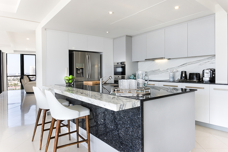 Kitchen with granite-top island.