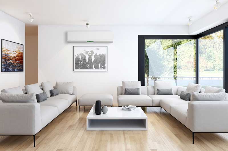 Living room with modern couches, and large glass windows.