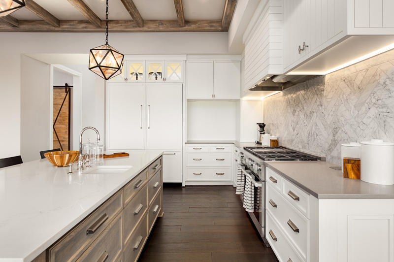 Kitchen with marble backsplash.