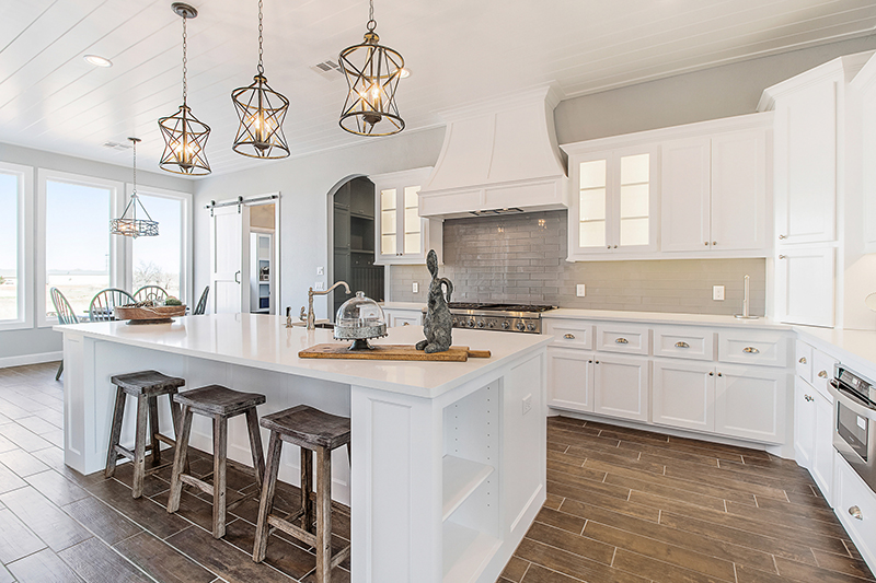 Modern kitchen with island and under-cabinet lightning.